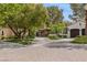 Charming home with a brick driveway, well-manicured lawn, and mature trees at 11814 Canons Brook Dr, Las Vegas, NV 89141
