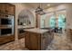 Chef's kitchen with white countertops, custom cabinets, and stainless steel appliances at 11814 Canons Brook Dr, Las Vegas, NV 89141