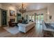 Bright living room with a fireplace, hardwood floors, and access to outdoor space at 11814 Canons Brook Dr, Las Vegas, NV 89141