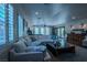 Inviting living room with abundant natural light, featuring a plush sofa and elegant decor at 11814 Canons Brook Dr, Las Vegas, NV 89141