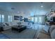 Spacious main bedroom suite offering a seating area, large windows, and modern decor at 11814 Canons Brook Dr, Las Vegas, NV 89141