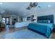Spacious main bedroom with seating area, ceiling fans, and private balcony access at 11814 Canons Brook Dr, Las Vegas, NV 89141