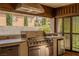 Well-equipped outdoor kitchen with built-in grill, offering ample counter space at 11814 Canons Brook Dr, Las Vegas, NV 89141