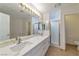 Bathroom featuring double sinks, shower, and toilet at 121 Golf Course St, Las Vegas, NV 89145