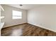 Cozy bedroom with modern flooring and a window providing natural light at 121 Golf Course St, Las Vegas, NV 89145