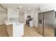 Modern kitchen with stainless steel appliances, white cabinets, and center island at 121 Golf Course St, Las Vegas, NV 89145
