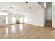 Spacious living room featuring tile floors, a fireplace, and plenty of natural light at 121 Golf Course St, Las Vegas, NV 89145