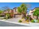 Charming two-story home with manicured landscaping and a brick driveway at 12391 Pinetina St, Las Vegas, NV 89141