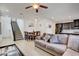Comfortable living room with tile flooring, open to the kitchen and dining area at 12391 Pinetina St, Las Vegas, NV 89141