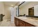 Bathroom featuring granite counters, framed mirror, and tile flooring with shower area at 1341 Marina Del Rey Ct, Las Vegas, NV 89117