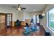 Versatile bonus room with hardwood floors, a ceiling fan, and space for both work and exercise equipment at 1341 Marina Del Rey Ct, Las Vegas, NV 89117
