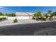Charming single-story home featuring a three-car garage, well-maintained landscaping, and a lengthy driveway at 1341 Marina Del Rey Ct, Las Vegas, NV 89117