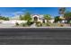 Inviting single-story home with a three-car garage, lush landscaping, and a welcoming front entrance at 1341 Marina Del Rey Ct, Las Vegas, NV 89117