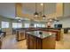 Spacious kitchen with island and breakfast bar offering views of an adjacent dining nook and living space at 1341 Marina Del Rey Ct, Las Vegas, NV 89117