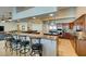 Spacious kitchen with stainless steel appliances, granite countertops, and ample seating at the breakfast bar at 1341 Marina Del Rey Ct, Las Vegas, NV 89117