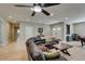 Spacious living room with wood and tile floors, leather sofa, and easy access to other rooms at 1341 Marina Del Rey Ct, Las Vegas, NV 89117