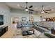Open-concept living room with large sectional sofa, open floor plan, and easy access to kitchen at 1341 Marina Del Rey Ct, Las Vegas, NV 89117