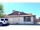 Exterior angle of a multi-unit residence under a clear sky with security features and covered stairwell at 1520 Henry Dr, Las Vegas, NV 89110