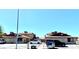Exterior view of well-maintained multi-unit residence with ample parking under a clear sky at 1520 Henry Dr, Las Vegas, NV 89110