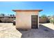 Exterior of a building with door in the backyard of this property at 1520 Henry Dr, Las Vegas, NV 89110