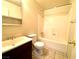 Bathroom with tile floors, toilet, vanity, and shower with tub at 1524 Henry Dr, Las Vegas, NV 89110