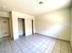 Neutral bedroom features tiled floors and a closet at 1524 Henry Dr, Las Vegas, NV 89110