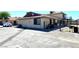 Property exterior showcasing parking, fenced-in yards, and private entryways on a bright day at 1524 Henry Dr, Las Vegas, NV 89110