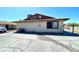 Exterior view of a one-story multi-Gathering property with a small window and parking at 1524 Henry Dr, Las Vegas, NV 89110