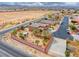 An aerial view showcasing the property, desert landscaping, and pergola at 193 Glenbrook Estates Dr, Las Vegas, NV 89183