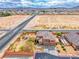 An aerial view of a desert home with manicured landscaping and a backyard pergola at 193 Glenbrook Estates Dr, Las Vegas, NV 89183