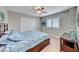 Comfortable bedroom with soft carpet, ceiling fan, window with shutters, and dresser with modern decor at 193 Glenbrook Estates Dr, Las Vegas, NV 89183