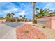 Stone sign at Glenbrook II community entrance with landscaped median at 193 Glenbrook Estates Dr, Las Vegas, NV 89183
