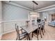 Formal dining room featuring elegant lighting fixture and wainscoting details at 193 Glenbrook Estates Dr, Las Vegas, NV 89183