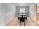 Elegant dining room featuring decorative wall trim and a modern chandelier above the table at 193 Glenbrook Estates Dr, Las Vegas, NV 89183