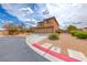 Charming two-story home with a three-car garage, desert landscaping, and paved driveway at 193 Glenbrook Estates Dr, Las Vegas, NV 89183