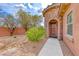 Charming home featuring a stone turret, neat landscaping, and a walkway to the front door at 193 Glenbrook Estates Dr, Las Vegas, NV 89183