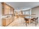 Spacious kitchen with custom cabinets, granite countertops, and a central island with bar seating at 193 Glenbrook Estates Dr, Las Vegas, NV 89183