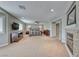 Large main bedroom with a fireplace, carpeted floors, and bright natural light at 193 Glenbrook Estates Dr, Las Vegas, NV 89183