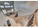 View from the top of the curved staircase, showcasing the open foyer and living area below at 193 Glenbrook Estates Dr, Las Vegas, NV 89183