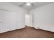 Bedroom features a ceiling fan, plush carpet, double-door closet, and window at 2099 Desert Woods Dr, Henderson, NV 89012