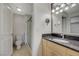 Well-lit bathroom features a shower and a sink with a decorative granite countertop at 210 E Flamingo Rd # 105, Las Vegas, NV 89169