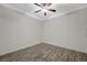Spacious bedroom with hardwood flooring, crown molding, and ceiling fan at 210 E Flamingo Rd # 105, Las Vegas, NV 89169