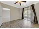 Comfortable bedroom with a ceiling fan and a sliding glass door for natural light at 210 E Flamingo Rd # 105, Las Vegas, NV 89169