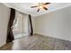 Inviting bedroom features a ceiling fan and a sliding glass door to the outdoor patio at 210 E Flamingo Rd # 105, Las Vegas, NV 89169