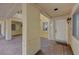 Welcoming entryway with a white door, textured walls, and covered patio space at 210 E Flamingo Rd # 105, Las Vegas, NV 89169
