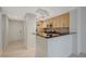 Modern kitchen with stainless steel appliances and granite countertops, open to the dining area at 210 E Flamingo Rd # 105, Las Vegas, NV 89169