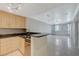 Bright kitchen with granite countertops, stainless steel appliances, and open layout to the living area at 210 E Flamingo Rd # 105, Las Vegas, NV 89169