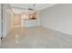 Spacious living room featuring tile flooring and a view into the modern kitchen area at 210 E Flamingo Rd # 105, Las Vegas, NV 89169