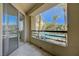 Relaxing patio offers a clear view of the sparkling community pool and swaying palm trees at 210 E Flamingo Rd # 105, Las Vegas, NV 89169