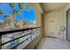 Open-air patio offers city views framed by swaying palm trees on a sunny day at 210 E Flamingo Rd # 105, Las Vegas, NV 89169